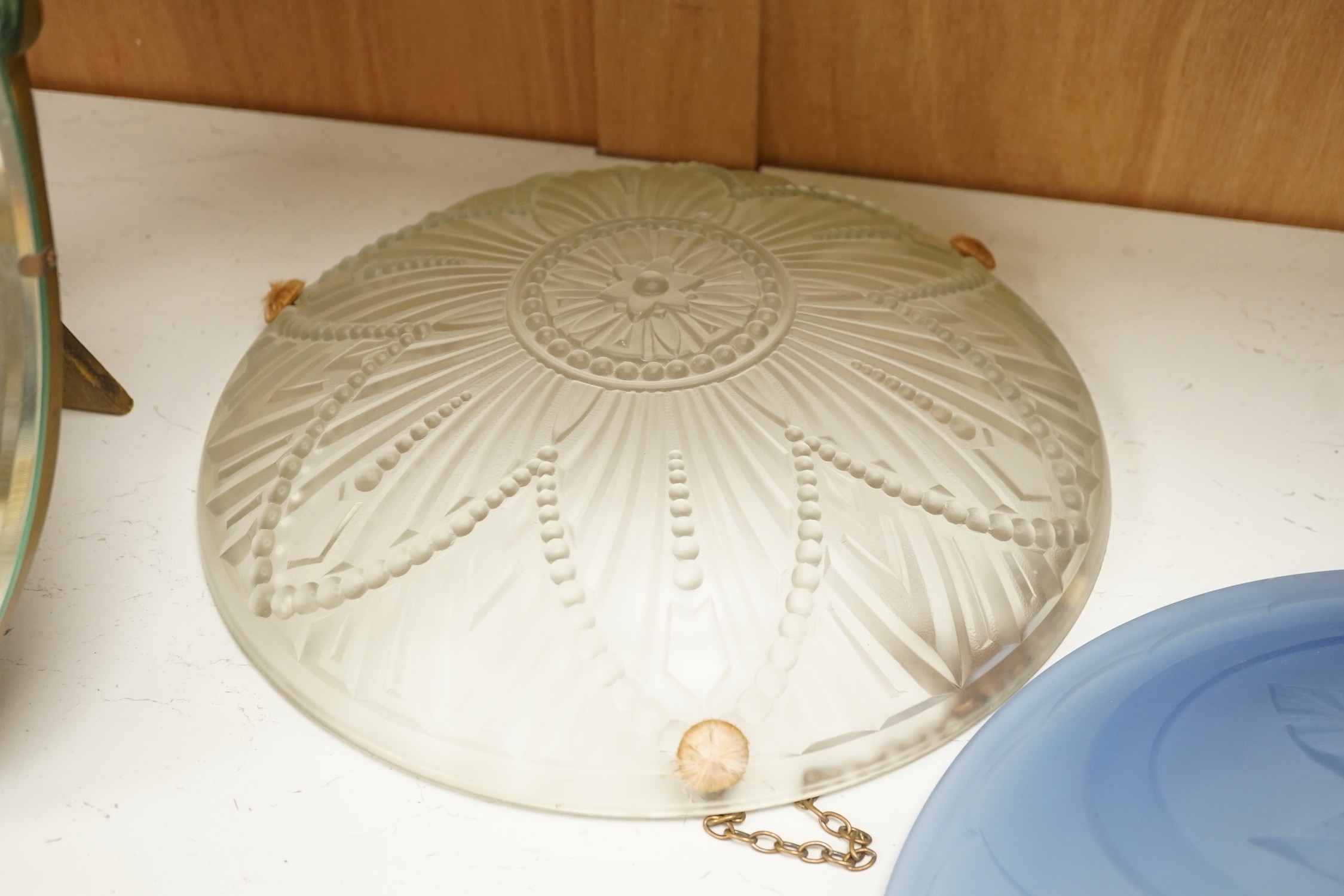 Two French pressed glass ceiling shades and a pair of barbola oval mirrors